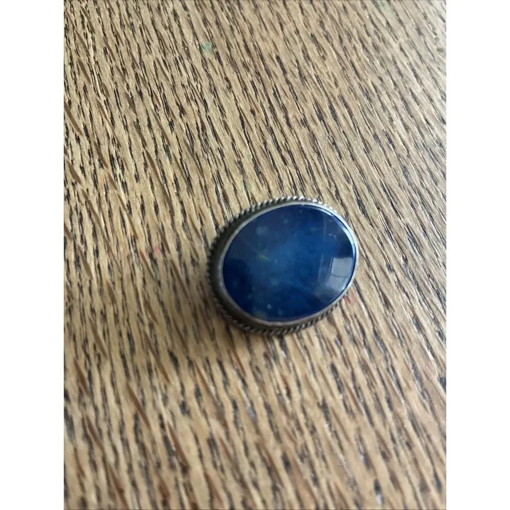 A Vintage Navajo Sterling Silver Sand Cast Brooch With A Lapis Cabochon